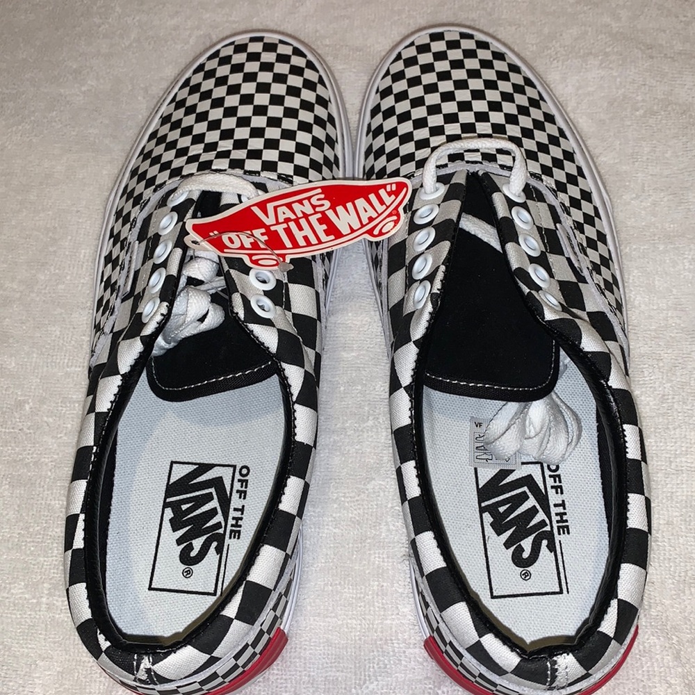 Men’s black and white checkerboard Vans